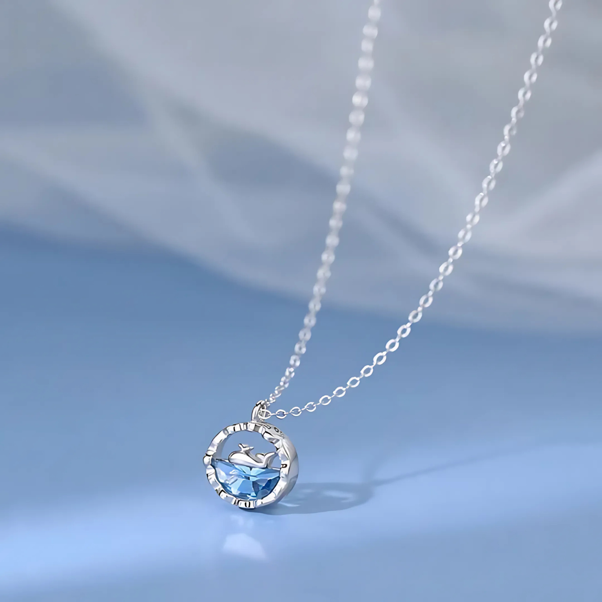 6.png Silver Dolphin Necklace with Ocean Blue Crystal Pendant - Image 1