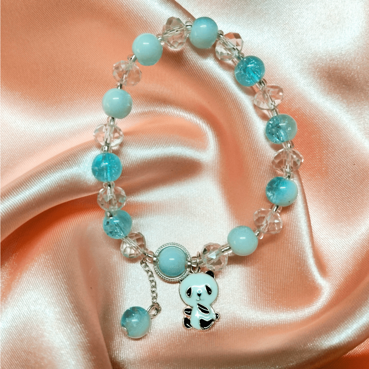 Blue-2.png Chic Blue and Crystal Beaded Bracelet with Adorable Teddy Bear Charm - Image 1