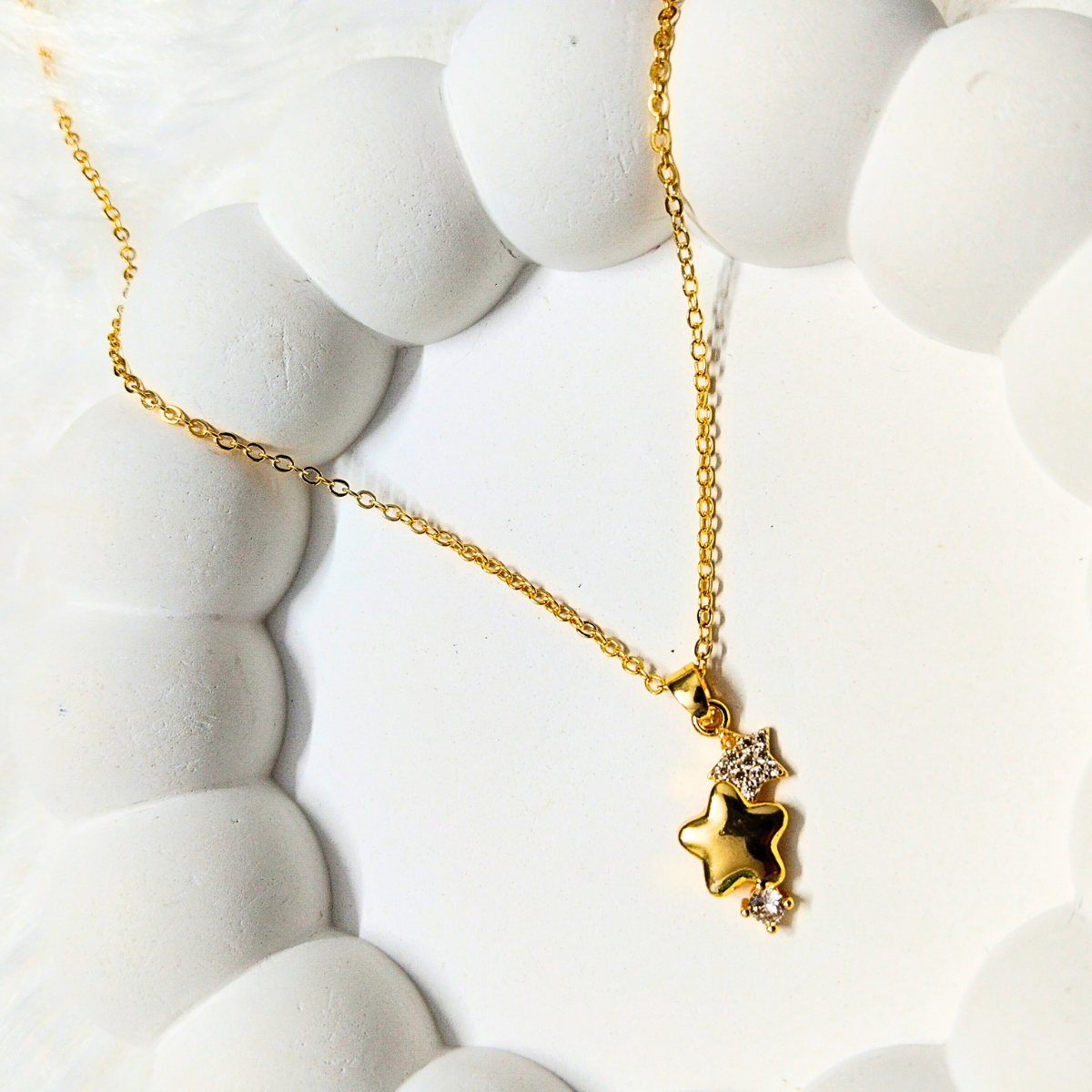 Star-Chain-e1745566385343.png Gold Star Pendant Necklace with Crystal Accents - Image 1